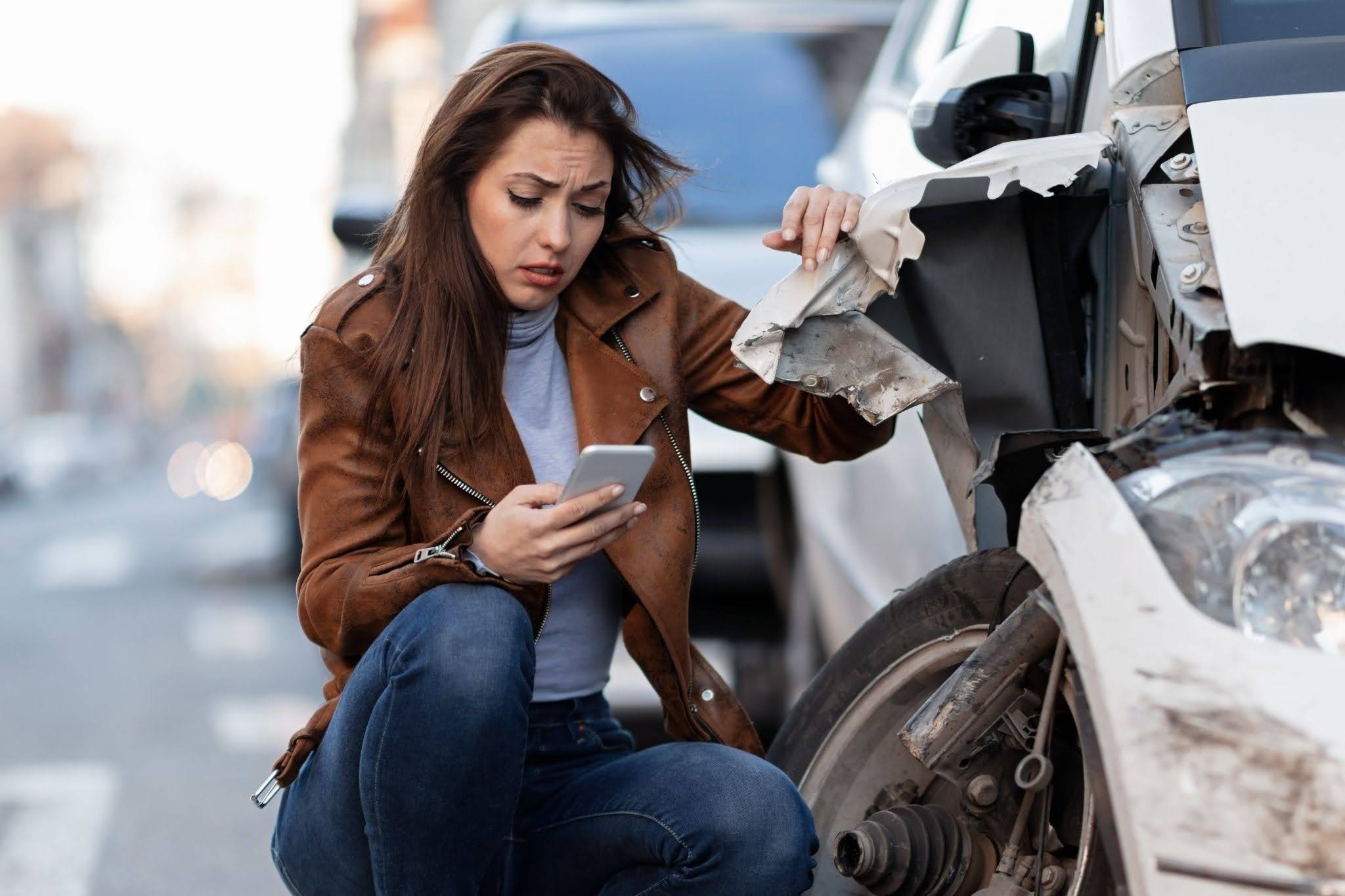 Worried woman after a car crash