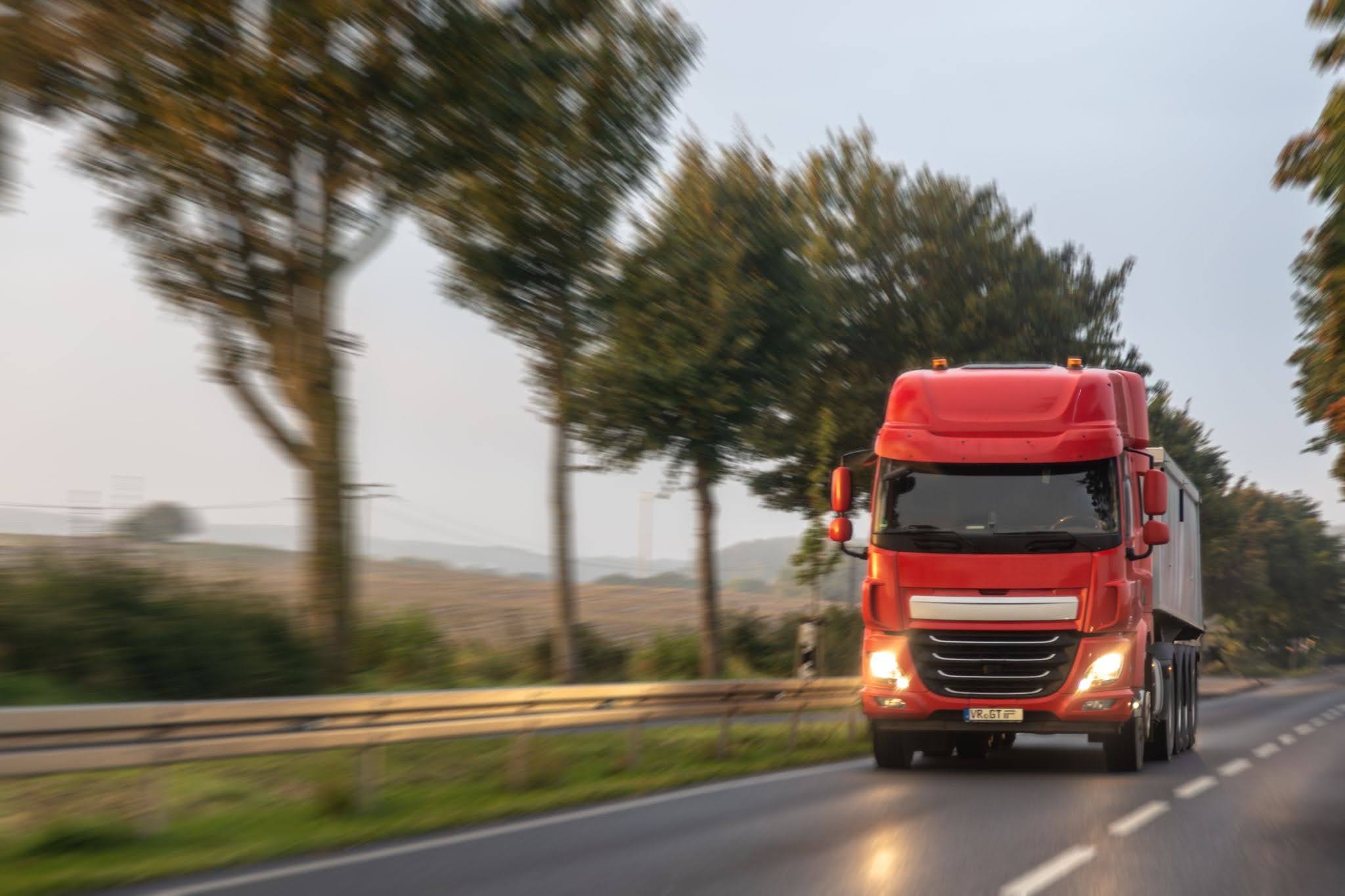 A truck speeding on the road.